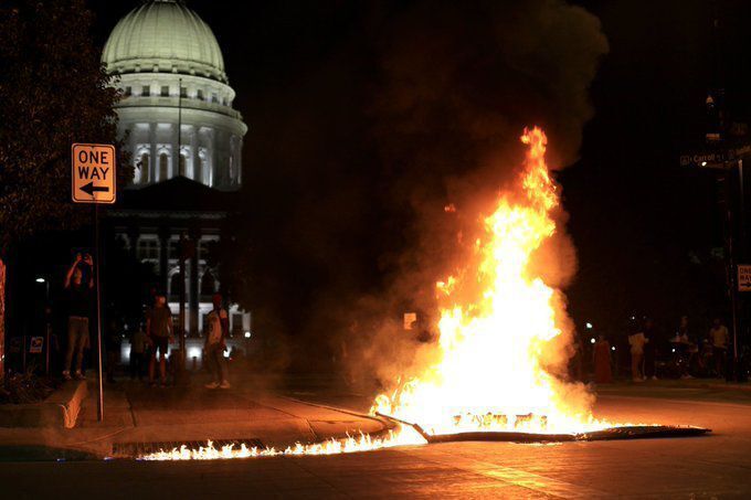 Madison protesters light dumpster fires, smash windows on Capitol Square; police bring out tear gas